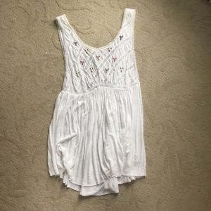 white flowy tank with embroidered flowers